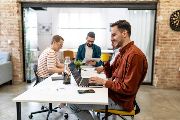 istock Young businessman working on laptop at the modern office 2152455346
