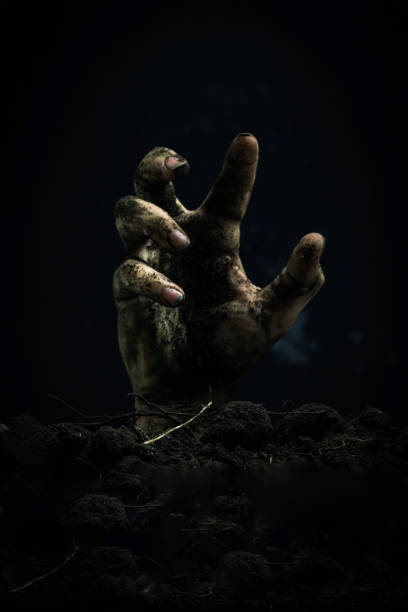 istock Creepy zombie hand on dark background with copy space. Halloween concept. 2152456121