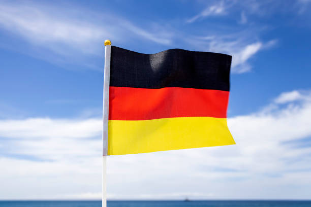 istock German flag in front of the sky and sea 2152460914