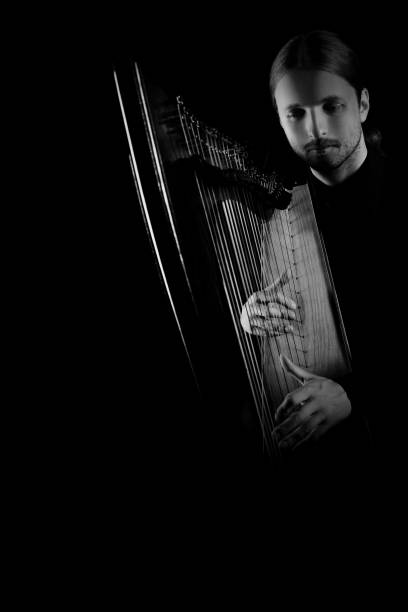 istock Irish Harp player. Harpist playing celtic harp  music 2152467573