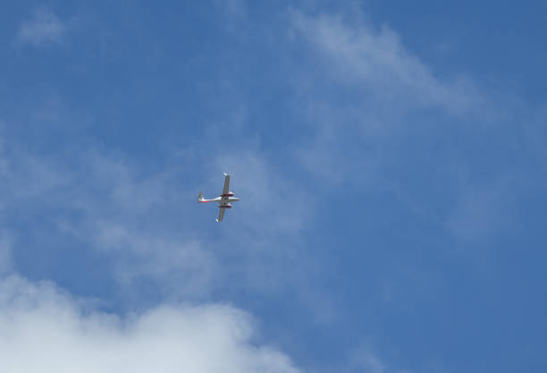 istock twin-engine plane against the background of clouds 2152469754