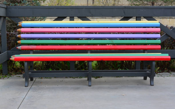 istock an empty colorful bench isolated in the park 2152469899