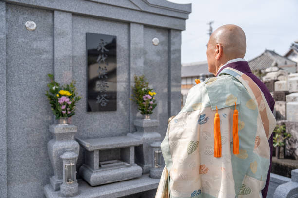 istock A monk praying in front of the tomb 2152469976