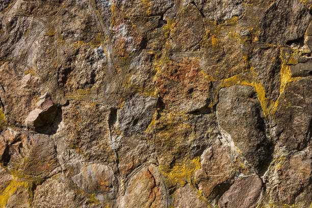 The old wall is made of stone. Background. Fragment close-up
