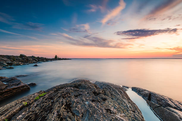 istock Majestic Sunset Over Lake With Rocks in Foreground 2152475743
