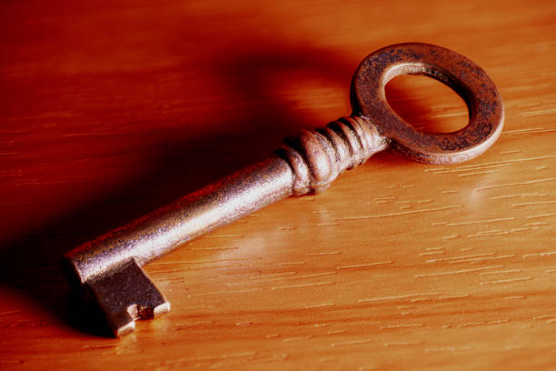 Extreme Close-Up of a Vintage Key on Brown Fabric with Shallow Depth of Field