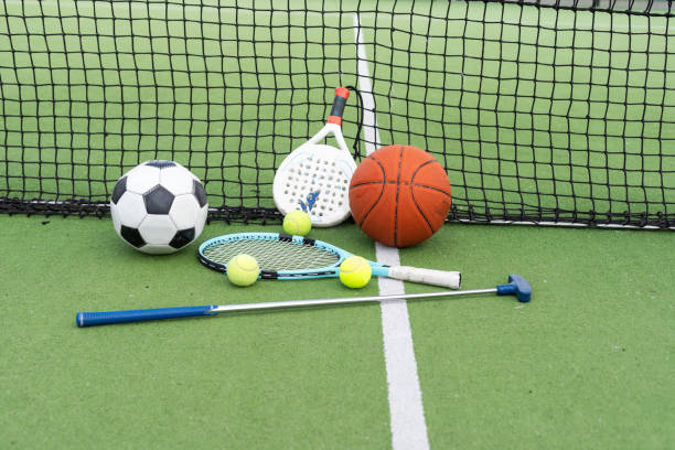 istock Different sport equipment on green grass, flat lay. Space for text 2152487682