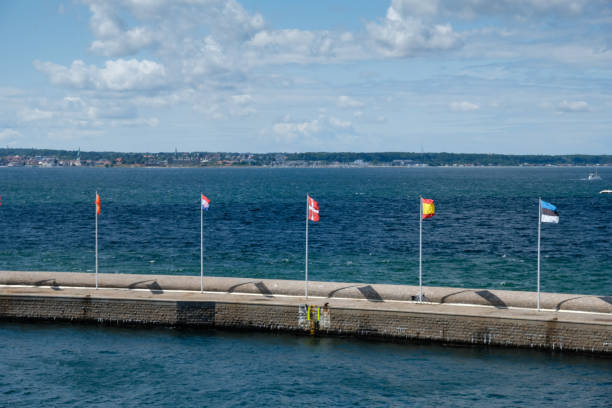Sweden Helsingborg port harbor pier lighthouse European flags