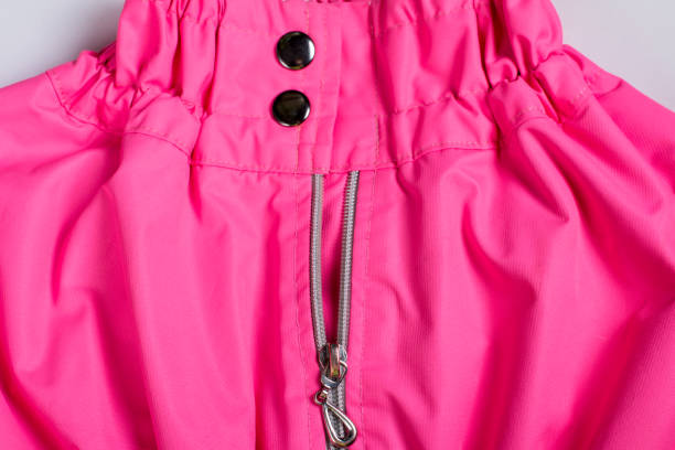 istock Zipper element on the jacket with metal buttons. Zipper on clothes 2152492225
