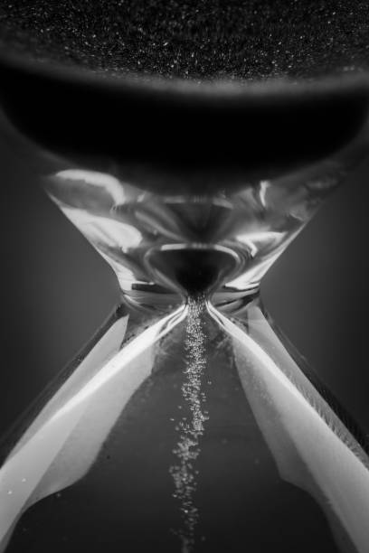 istock Blue sand hourglass on black background 2152492348
