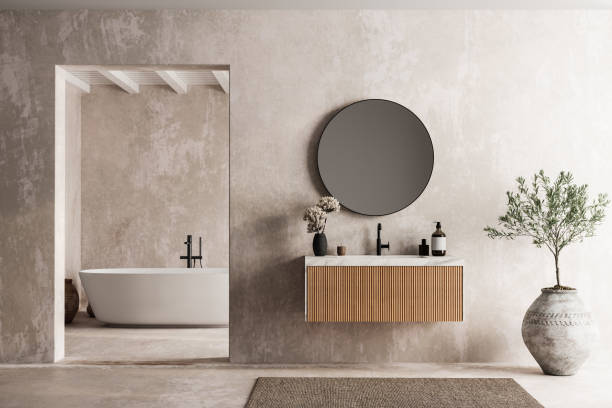 istock Modern minimalist bathroom interior, modern bathroom cabinet, white sink, wooden vanity, interior plants, bathroom accessories, bathtub and shower, beige walls, granite floor, vases. 2152506317