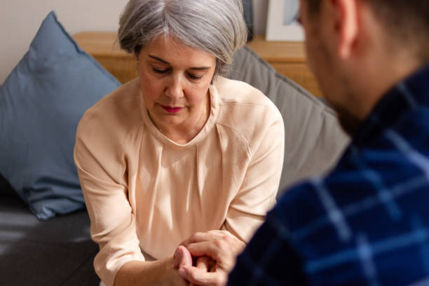 istock Compassionate conversation between senior woman and man 2152509695