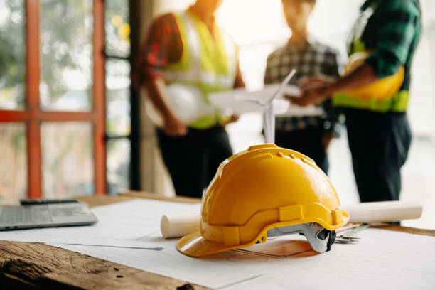 istock Engineer teams meeting working together wear worker helmets hardhat on construction site in modern city.Asian industry professional team 2152511017