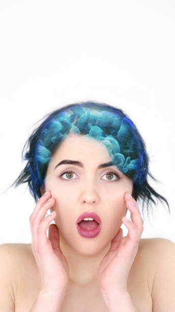Brainwashing manipulation. Thought control. Shocked scared woman with blue smoke cloud hair effect isolated on white background empty space.