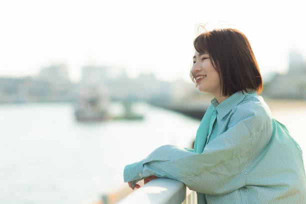 istock A woman having fun at the seaside 2152520974