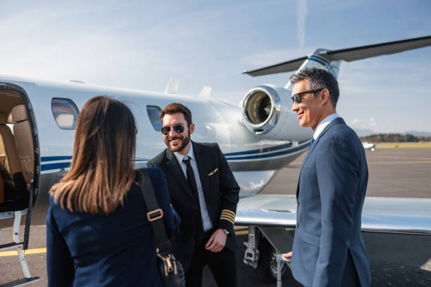 istock Asian Executives and Pilot Greeting by Private Jet 2152523806