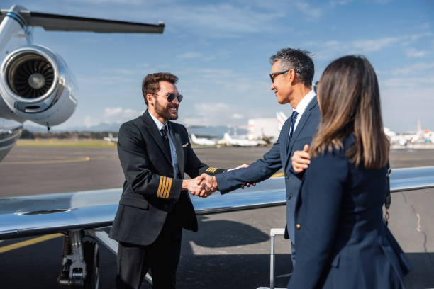 istock Business Executives Greeting Pilot by Private Jet 2152523810