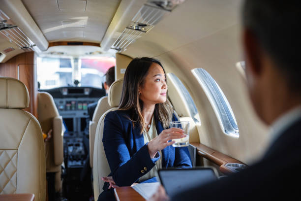 istock Business Executive Drinking Whiskey on a Private Jet 2152523820