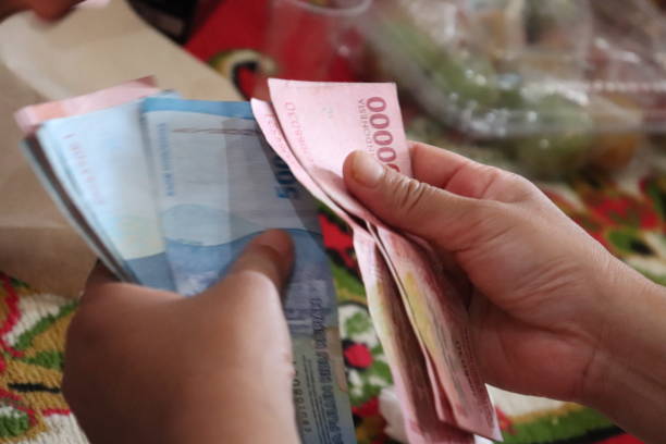 istock Counting Indonesian money 2152529493