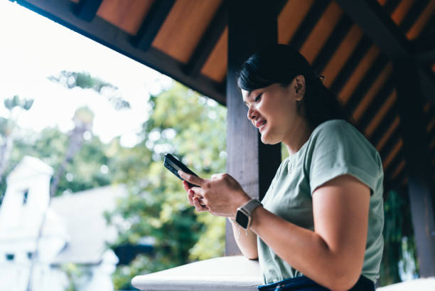 istock asian woman  using tablet when Working from Anywhere in flexible working 2152536288