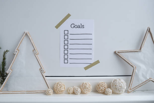 istock Paper note with inspirational to do checklist GOALS with natural zero waste homemade Christmas decor. Happy new year promises resolutions. Self growth and personal development 2152537029