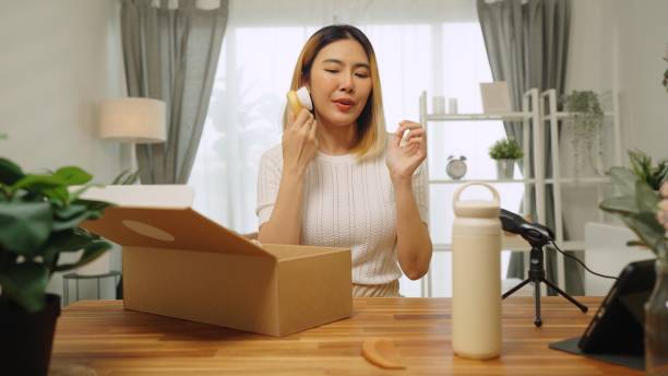 istock Asian woman  influencer unboxing open cardbox order gift parcel reusable bottles in zero waste recycling,sustainable lifestyle,plastic free envionment ,eco friendly concept ,live streaming record online video in living room at home 2152541344