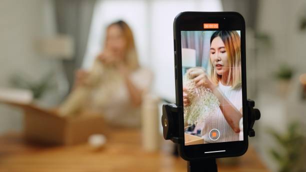 istock Asian woman  influencer unboxing open cardbox order gift parcel reusable bottles in zero waste recycling,sustainable lifestyle,plastic free envionment ,eco friendly concept ,live streaming record online video in living room at home 2152541348