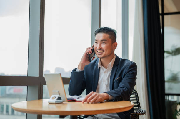 istock Asian Businessman on tele-conversation 2152547354