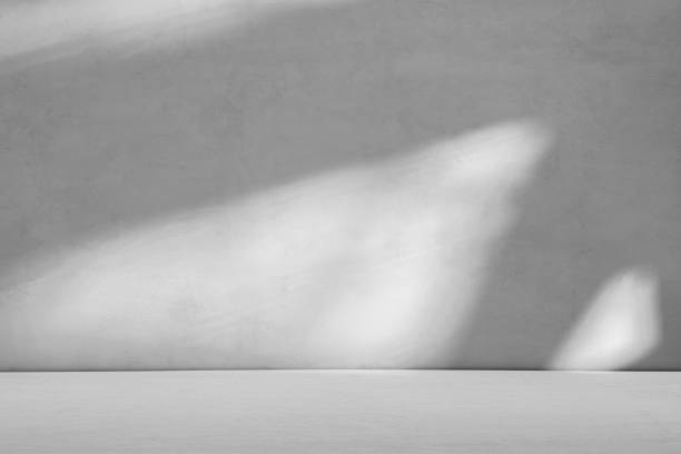 istock Gray concrete background with sunlight and shadows in attic room space 2152548966