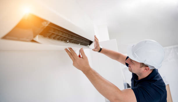 istock technician cleans air conditioner system in a modern apartment. 2152549636