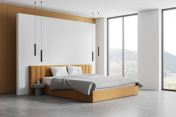 istock Modern bedroom interior with a large bed, panoramic windows, and a scenic view, minimalistic style, light background. 3D Rendering 2152552242
