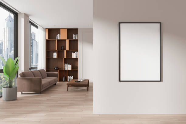 istock White living room home library interior with couch, bookcase and blank poster frame 2152552301