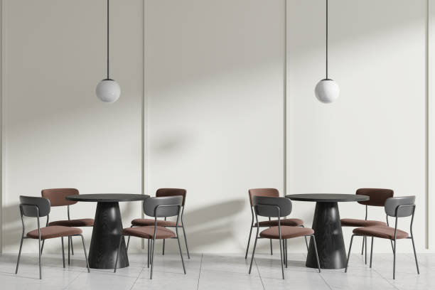 istock Modern minimalist cafe interior with black tables, brown chairs, pendant lights, on a plain background, concept of a stylish eatery. 3D Rendering 2152552308