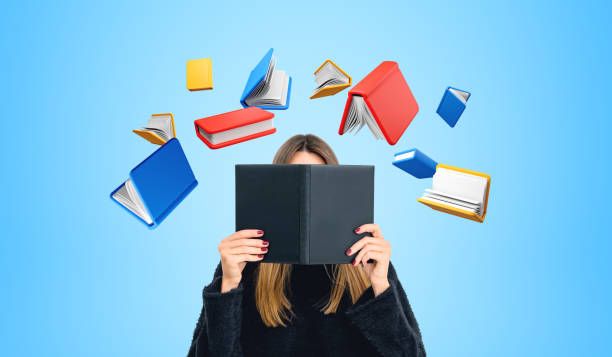 istock Woman student with book and education icons 2152552662