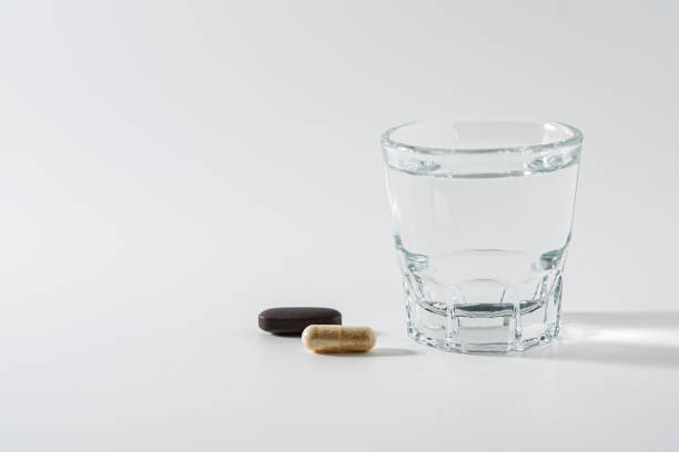 istock Pills and glass of water 2152552842