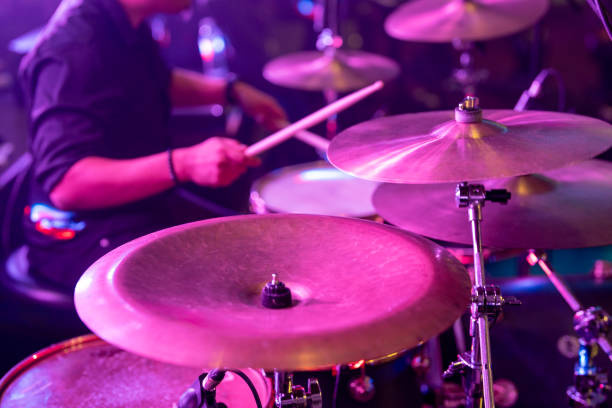 istock A close-up of a drummer playing on a drum set and cymbals on stage. 2152554255