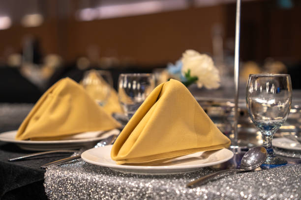 A luxury banquet hall adorned with reception dining table decorations.