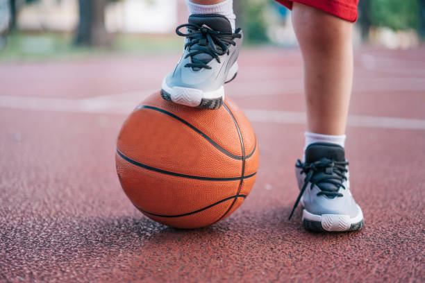 istock Low section of boy with basketball 2152559925