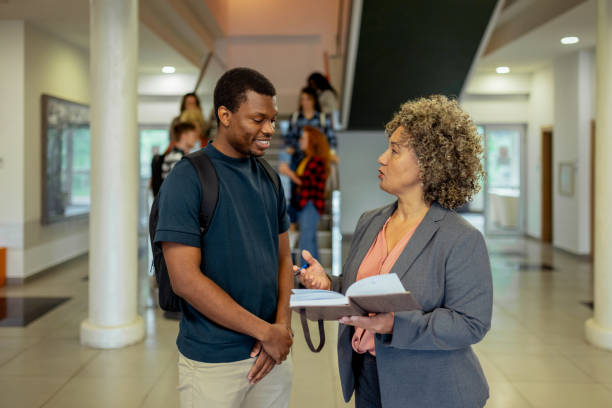 istock Black College Student Talking With Professor at University 2152560463