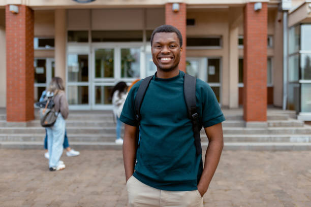 istock Happy African American College Student Looking at Camera Over University Building 2152560494