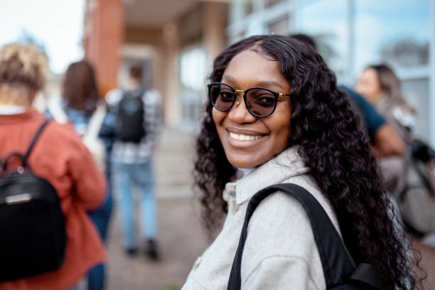 istock Smiling Black Female Student Walking Toward Class 2152560533