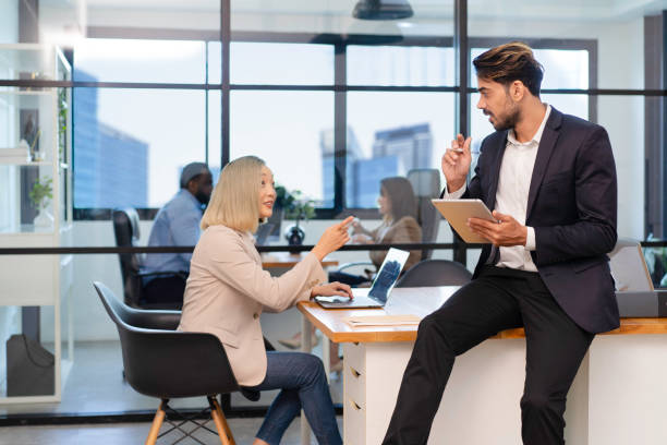 istock businessman manager discuss with colleague employee about output team performance 2152561917
