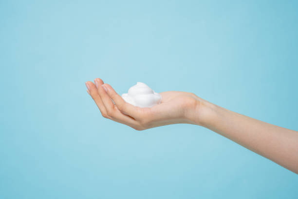 istock Asian hand and bubble textures photographed against a blue background 2152563864