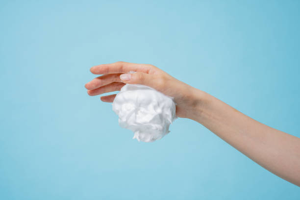 istock Asian hand and bubble textures photographed against a blue background 2152563928