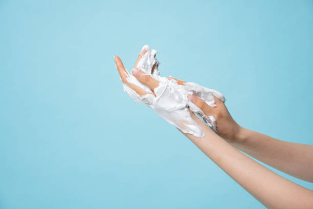 istock Asian hand and bubble textures photographed against a blue background 2152565093