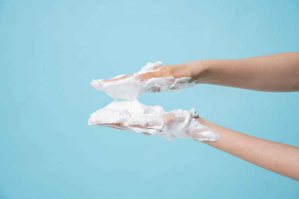 istock Asian hand and bubble textures photographed against a blue background 2152565295