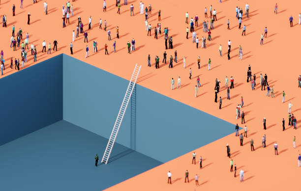 A Person Standing In A Pit Before Crowd Of People And A White Ladder
