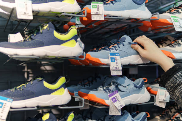 Boy Shopping for New Shoes in Fashion Store
