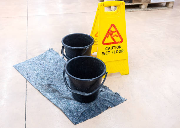 istock Caution Wet Floor warning sign on a tile floor in a superstore 2152577696