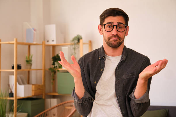 istock A man is looking at the camera with a confused expression on his face. 2152580023